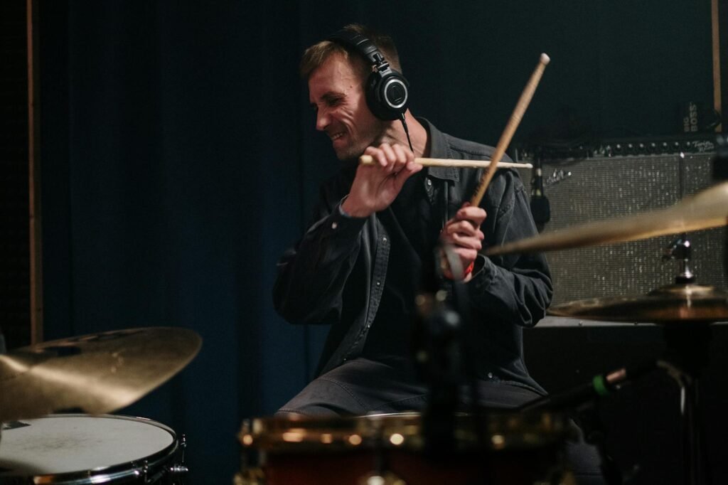 man playing drums passionately